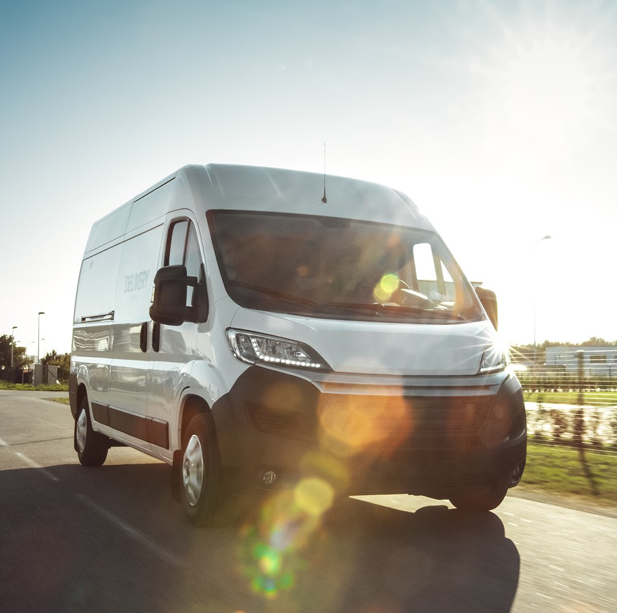 A new Fiat van drives down the road, ideal for asset finance options tailored to business vehicle investment