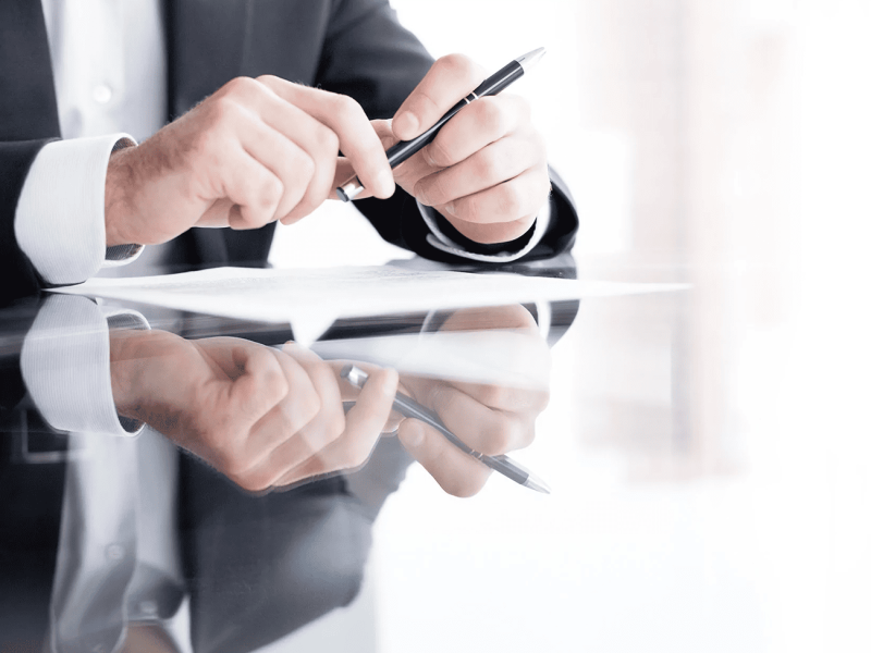 2025 Business Landscape - Man reading legal document